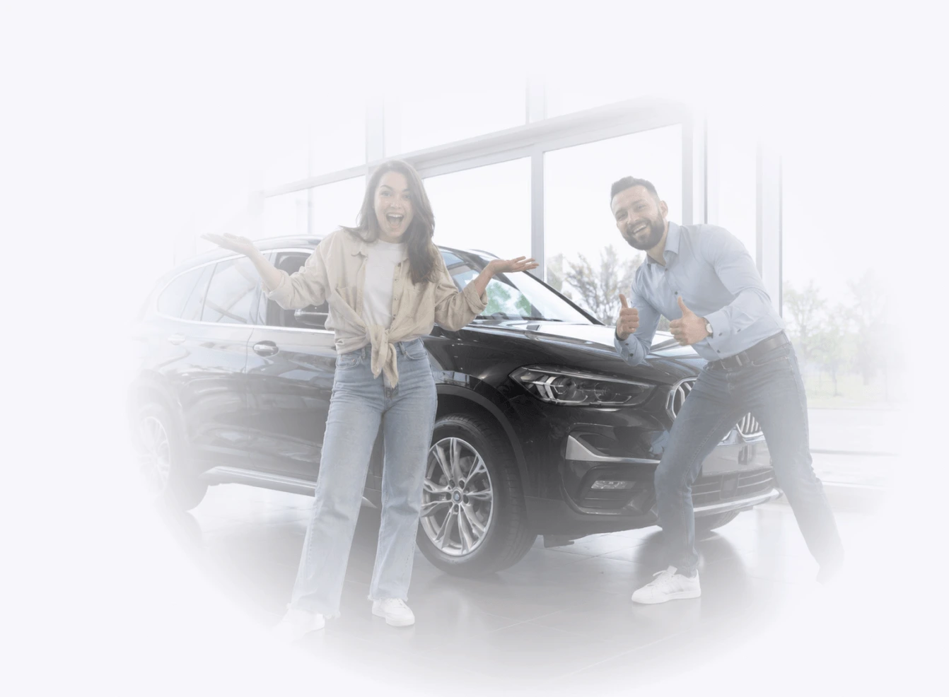 Happy couple at a car dealership